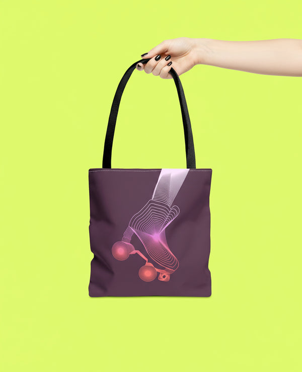 A hand holding a purple tote bag with a graphic design of a skateboard on it against a bright yellow background.